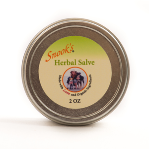 Herbal Salve made with Food Grade ingredients that can be used on hot spots, sores on pads and abrasions or bites.  Top view of 2oz tin shown